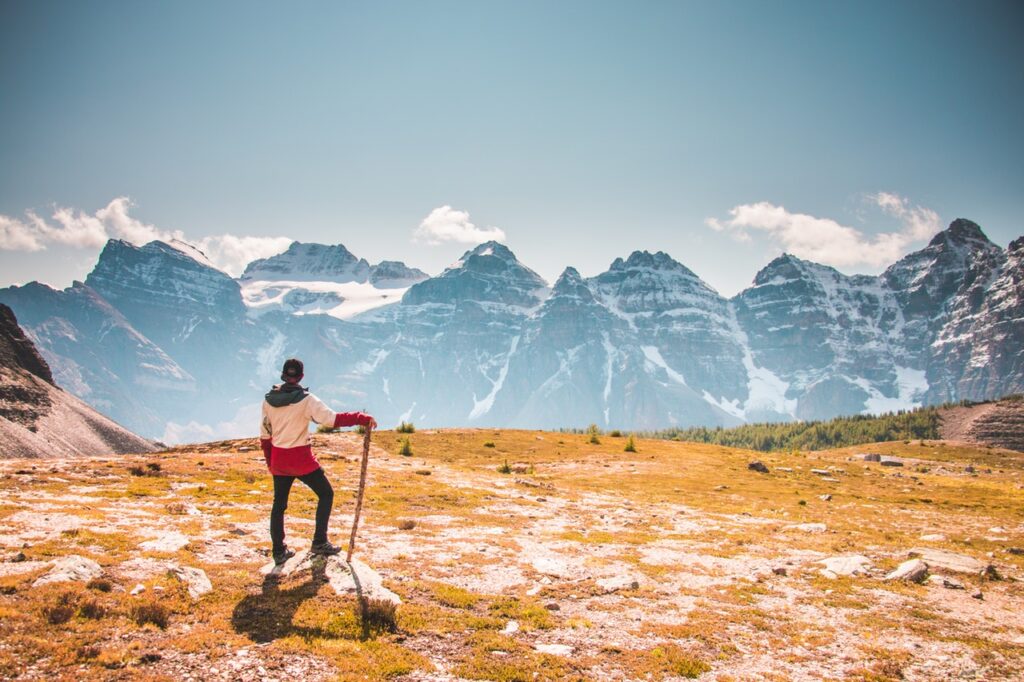 man standing on top of mountain